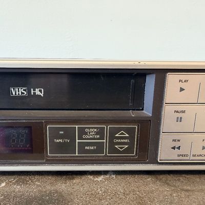 Sale Photo Thumbnail #17: Vintage Zenith 4-Head VHS HQ video cassette recorder (VCR), model VR 1825. Features a simulated wood grain cabinet, front drop-down control panel with timer programming instructions, RCA video/audio inputs and outputs, and coaxial antenna connections. Ser