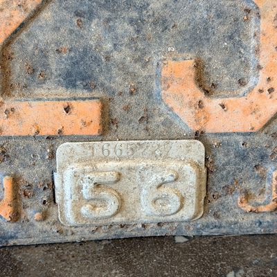 Sale Photo Thumbnail #47: Matching pair of vintage 1956 New Jersey metal license plates, registration number ZA 23F. Each plate features embossed orange characters on a dark background with an attached metal '56' tab (stamped 1665727). Both plates show significant age, surface rus