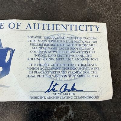 Sale Photo Thumbnail #38: Original blue stadium seat #4 from Veterans Stadium, former home of the Philadelphia Phillies and Eagles. Features molded plastic seat and back with heavy-duty metal frame/supports and metal seat number plate. Includes Certificate of Authenticity signed b