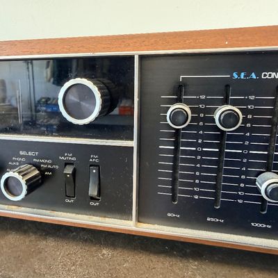 Sale Photo Thumbnail #6: Vintage JVC Model 5020 FM/AM stereo receiver featuring a built-in S.E.A. equalizer control system. Encased in a wood cabinet with a black front panel, illuminated green tuner display, and brushed metal accent trim. Manufactured by Victor Co. of Japan, Ltd