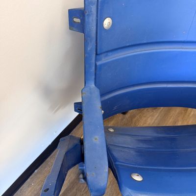 Sale Photo Thumbnail #32: Original blue stadium seat #4 from Veterans Stadium, former home of the Philadelphia Phillies and Eagles. Features molded plastic seat and back with heavy-duty metal frame/supports and metal seat number plate. Includes Certificate of Authenticity signed b