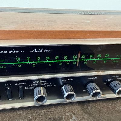 Sale Photo Thumbnail #3: Vintage JVC Model 5020 FM/AM stereo receiver featuring a built-in S.E.A. equalizer control system. Encased in a wood cabinet with a black front panel, illuminated green tuner display, and brushed metal accent trim. Manufactured by Victor Co. of Japan, Ltd