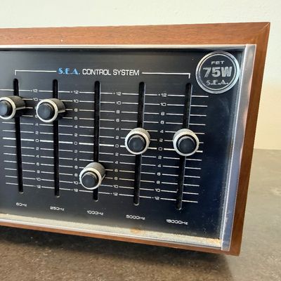 Sale Photo Thumbnail #7: Vintage JVC Model 5020 FM/AM stereo receiver featuring a built-in S.E.A. equalizer control system. Encased in a wood cabinet with a black front panel, illuminated green tuner display, and brushed metal accent trim. Manufactured by Victor Co. of Japan, Ltd