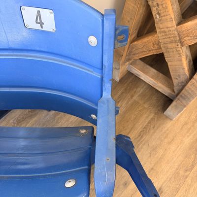 Sale Photo Thumbnail #31: Original blue stadium seat #4 from Veterans Stadium, former home of the Philadelphia Phillies and Eagles. Features molded plastic seat and back with heavy-duty metal frame/supports and metal seat number plate. Includes Certificate of Authenticity signed b