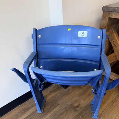 Sale Photo Thumbnail #28: Original blue stadium seat #4 from Veterans Stadium, former home of the Philadelphia Phillies and Eagles. Features molded plastic seat and back with heavy-duty metal frame/supports and metal seat number plate. Includes Certificate of Authenticity signed b