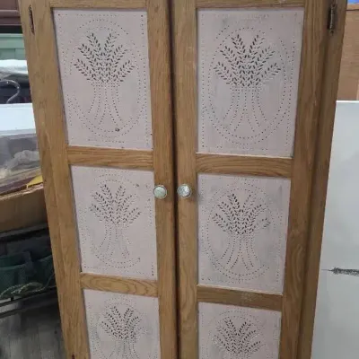 Primitive Style Wooden Cabinet Featuring Punched Tin Panels with a Wheat Pattern 