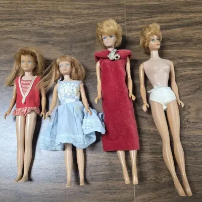 Collection of Vintage Mattel Dolls Featuring 1960s Barbie, Midge, and Skipper Models.