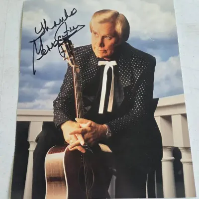 vintage autographed 8x10 photograph featuring country music legend George Jones.