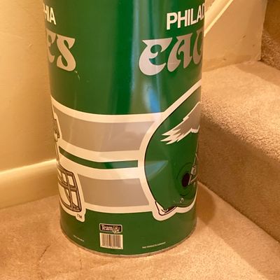 LOT 67: Philadelphia Sports Memorabilia - Vintage Eagles Construction Helmet, Metal Trash Can, Pair of Drinking Glasses, Flyers Plush and...