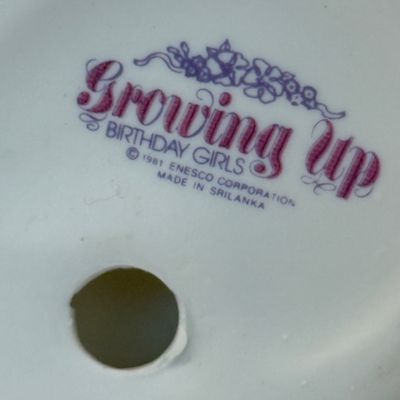 LOT 53: Humpty Dumpty Collectors Plate Enesco Growing Up Birth Girls, and 75th Anniversary Winnie The Pooh Book
