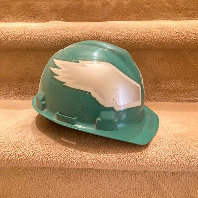 LOT 67: Philadelphia Sports Memorabilia - Vintage Eagles Construction Helmet, Metal Trash Can, Pair of Drinking Glasses, Flyers Plush and...
