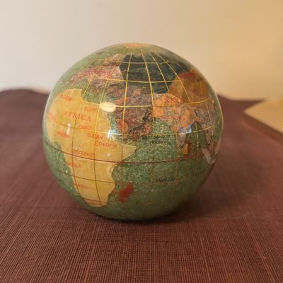 LOT 84: Gold Brass Tabletop World Globe w/Gemstone Inlay, World Globe w/ Inlay Gemstone Paperweight & Miksa Picture Frame