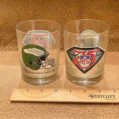 LOT 67: Philadelphia Sports Memorabilia - Vintage Eagles Construction Helmet, Metal Trash Can, Pair of Drinking Glasses, Flyers Plush and...