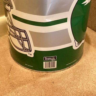 LOT 67: Philadelphia Sports Memorabilia - Vintage Eagles Construction Helmet, Metal Trash Can, Pair of Drinking Glasses, Flyers Plush and...