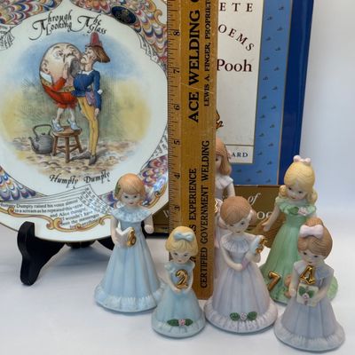 LOT 53: Humpty Dumpty Collectors Plate Enesco Growing Up Birth Girls, and 75th Anniversary Winnie The Pooh Book