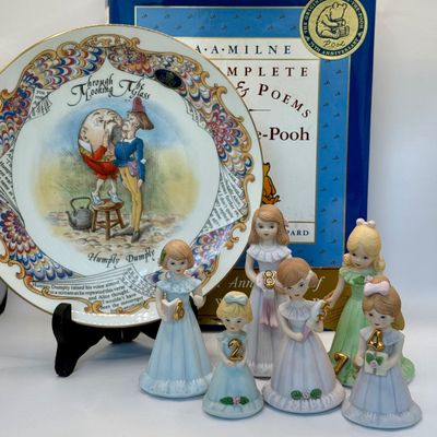 LOT 53: Humpty Dumpty Collectors Plate Enesco Growing Up Birth Girls, and 75th Anniversary Winnie The Pooh Book