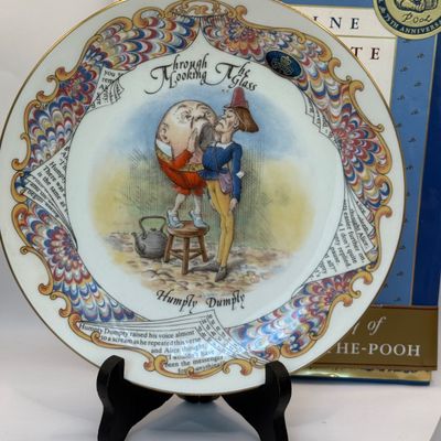 LOT 53: Humpty Dumpty Collectors Plate Enesco Growing Up Birth Girls, and 75th Anniversary Winnie The Pooh Book