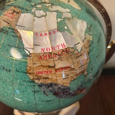 LOT 84: Gold Brass Tabletop World Globe w/Gemstone Inlay, World Globe w/ Inlay Gemstone Paperweight & Miksa Picture Frame