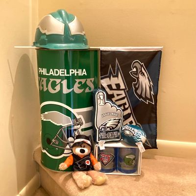 LOT 67: Philadelphia Sports Memorabilia - Vintage Eagles Construction Helmet, Metal Trash Can, Pair of Drinking Glasses, Flyers Plush and...