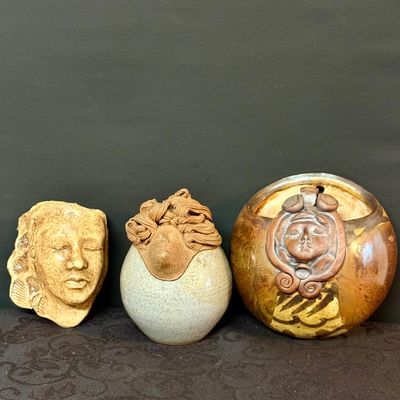 LOT 41: Trio of Studio Pottery Pieces Feating Faces - 2 Wall Pockets and a Lidded Jar