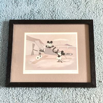 LOT 59: Framed Walt Disney Good Luck Charm / Plane Crazy 1928 Print with Souvenir Mickey Mouse and Collection of Books
