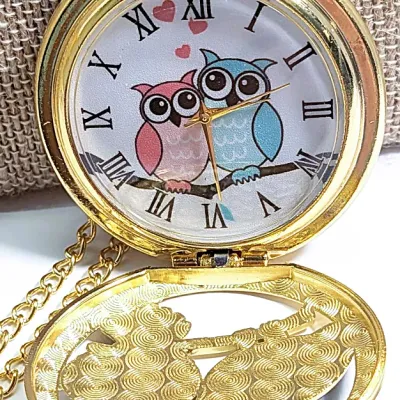 Sale Photo Thumbnail #6: Very Cute OWL POCKET WATCH with Blue/Green Feathers & Green Eyes, Gold Tone Setting and 30" L Chain/Lobster Clasp**EXTRA BATTERY INCLUDED**

QUARTZ
Non-rechargeable Battery
Brand: ALPHYNIX
Case Shape & Type: Round & Gold Colored
Display: Analog
Feature: S