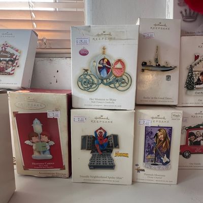 Collection of boxed Hallmark Keepsake Christmas ornaments including Disney Cinderella's Carriage, Friendly Neighborhood Spider-Man,...