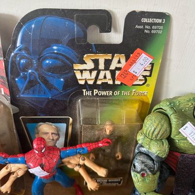 Collection of comic book and sci-fi action figures, featuring a vintage 1990s Star Wars The Power of the Force Grand Moff Tarkin carded...