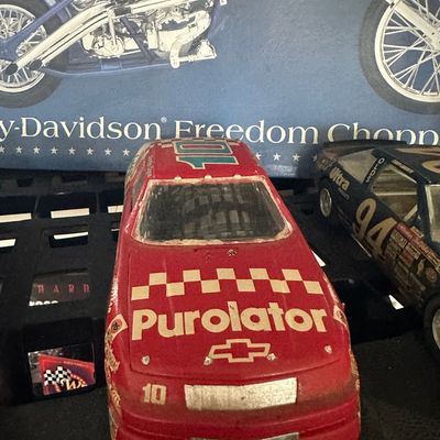 Vintage 1/24 scale #10 Purolator Chevrolet NASCAR model car, displaying light surface wear.