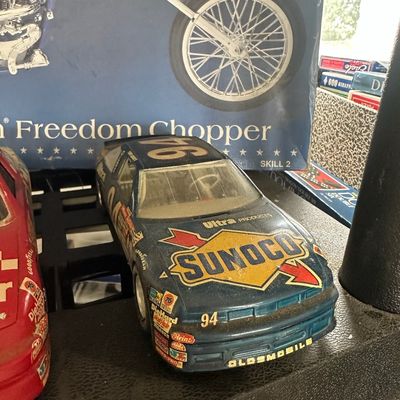 Vintage built NASCAR model car featuring Sunoco #94 livery, displaying moderate surface dust and wear.