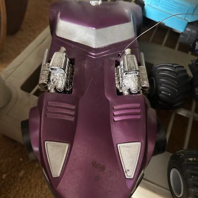 Vintage purple Hot Wheels Twin Mill plastic toy car featuring dual chrome engine details, showing light surface wear.
