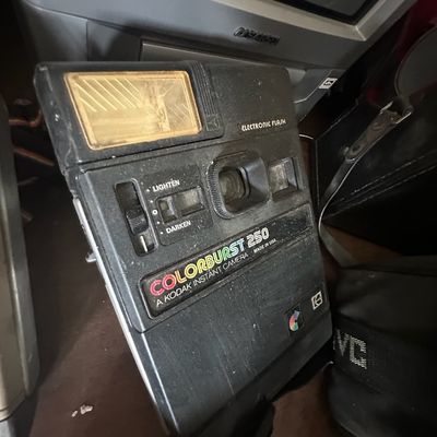 Vintage Kodak Colorburst 250 instant camera featuring a built-in electronic flash and dark/lighten adjustment slider, circa late 1970s to...
