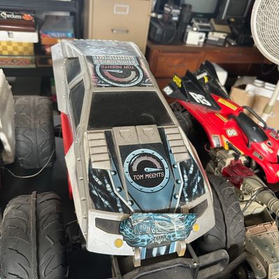 Vintage Monster Mutt / Tom Meents themed remote control monster truck, featuring large rubber tires and custom graphics, alongside other...