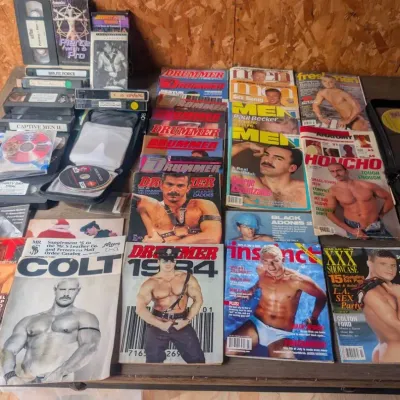 Collection of Vintage Gay Adult Entertainment and Erotica, including Magazines, VHS tapes, and DVDs