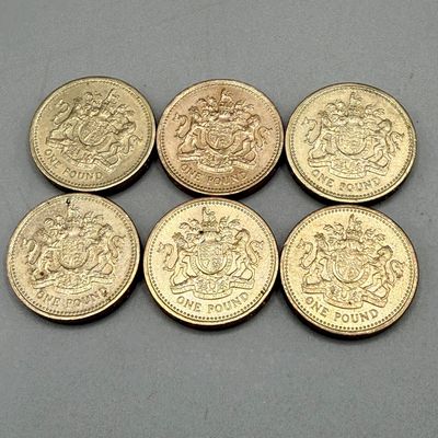 LOT 39: 1983 British Pound Coins (9) - Six with Upside Down Writing on Side Error