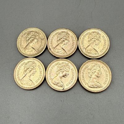LOT 39: 1983 British Pound Coins (9) - Six with Upside Down Writing on Side Error