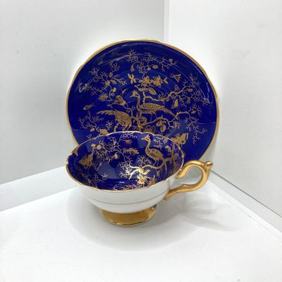 LOT 102: The Peacock Collection - Assorted Peacock Decor (Tracy Porter Serving Plate, Napkin Holder, Coalport Tea Cup / Saucer) and More