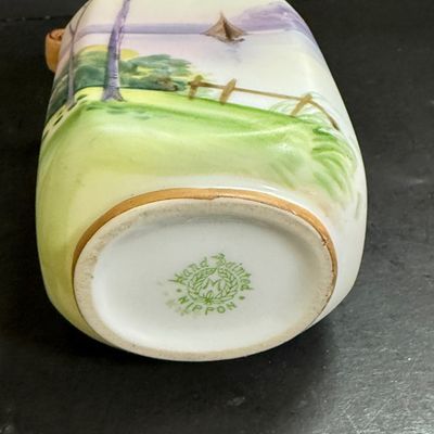 LOT 125: Collection of Painted Nippon Porcelain- Creamers, Pitcher, Plates and More