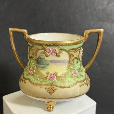 LOT 125: Collection of Painted Nippon Porcelain- Creamers, Pitcher, Plates and More
