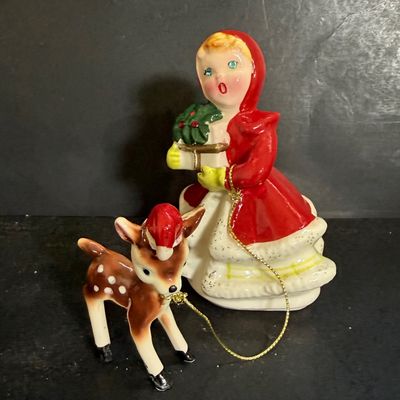 LOT 113: Vintage Kreisler Christmas Shopper with Reindeer and Napco Kissing Angel Shaker