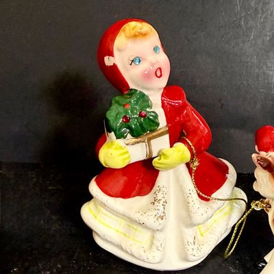 LOT 113: Vintage Kreisler Christmas Shopper with Reindeer and Napco Kissing Angel Shaker