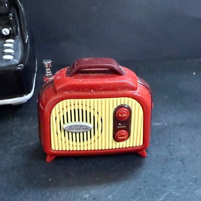 LOT 124: Mr Peanut Cast Iron Bank, ERTL Maytag Ringer Washing Machine Model, Mini Radio, Typewriter Teapot and More