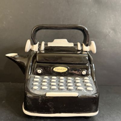 LOT 124: Mr Peanut Cast Iron Bank, ERTL Maytag Ringer Washing Machine Model, Mini Radio, Typewriter Teapot and More