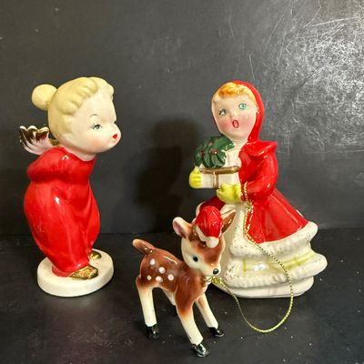 LOT 113: Vintage Kreisler Christmas Shopper with Reindeer and Napco Kissing Angel Shaker