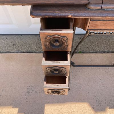 LOT 60: Vintage / Antique Rolling Singer Sewing Machine Cabinet with Wrought Iron Base