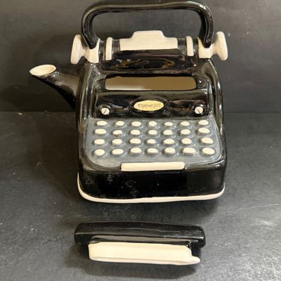 LOT 124: Mr Peanut Cast Iron Bank, ERTL Maytag Ringer Washing Machine Model, Mini Radio, Typewriter Teapot and More