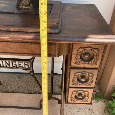 LOT 60: Vintage / Antique Rolling Singer Sewing Machine Cabinet with Wrought Iron Base