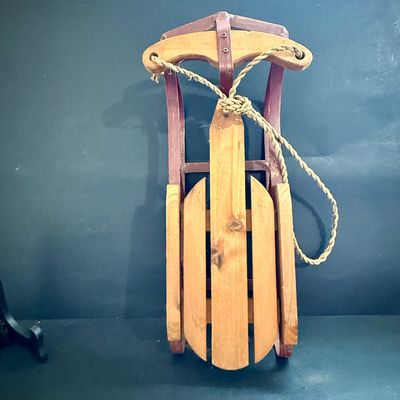 LOT 129: Victorian Christmas Sleigh Ride Decor Including Miniature Wood Sled, Pictures, Plates, Snow-globe and More