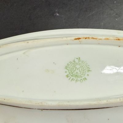 LOT 125: Collection of Painted Nippon Porcelain- Creamers, Pitcher, Plates and More