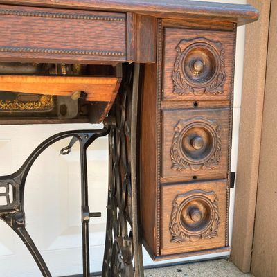 LOT 60: Vintage / Antique Rolling Singer Sewing Machine Cabinet with Wrought Iron Base